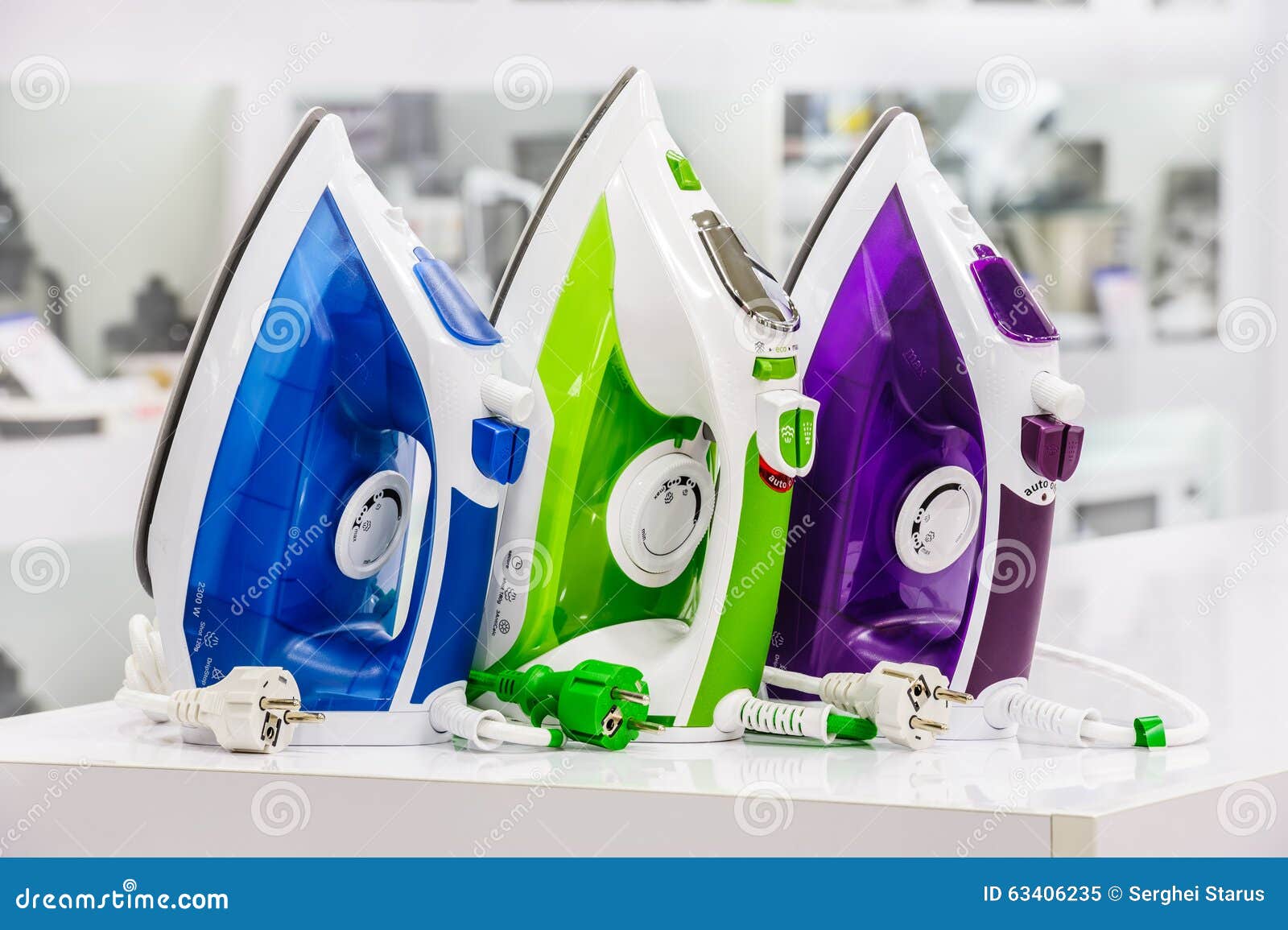 Three Electric Irons in Retail Store Stock Image Image of silver