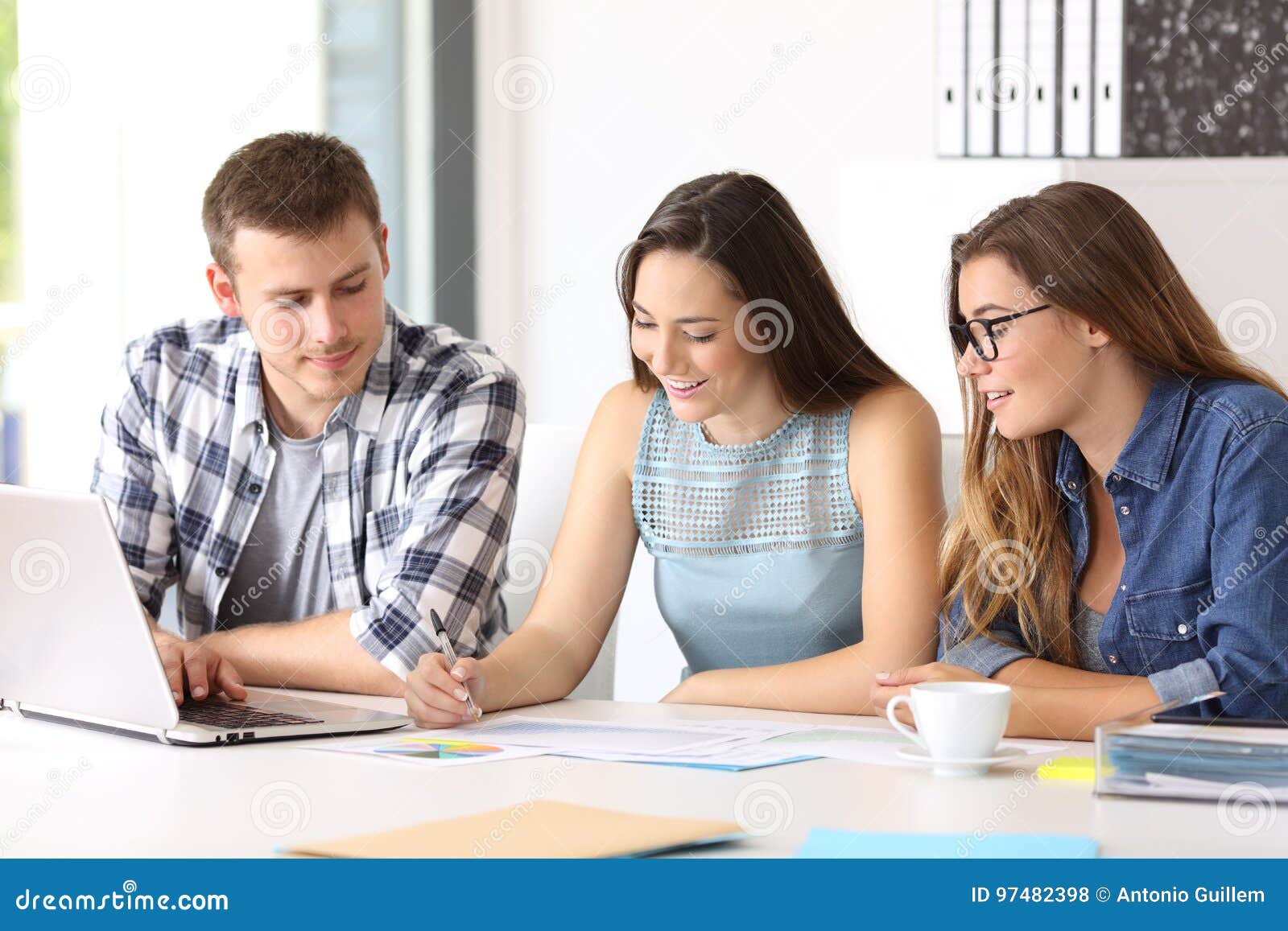 three employees coworking at office