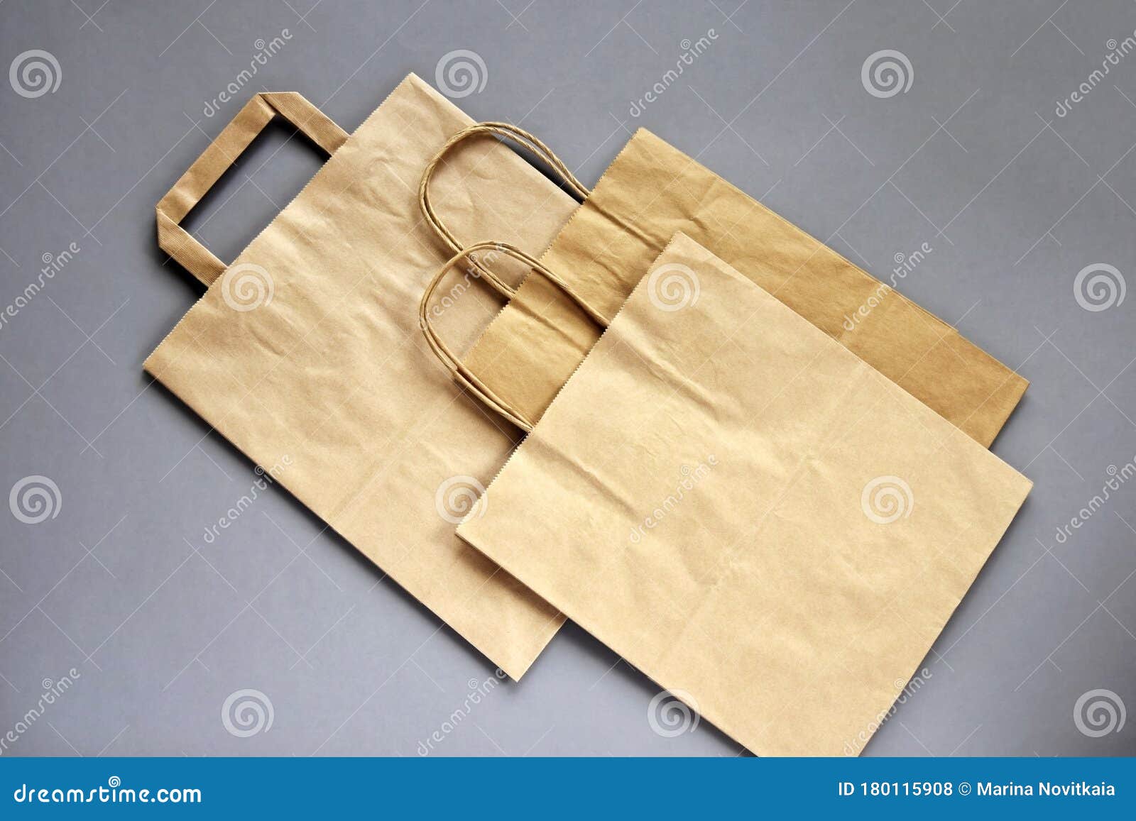 Download Three Empty Brown Shopping Bags With Handles On Gray ...