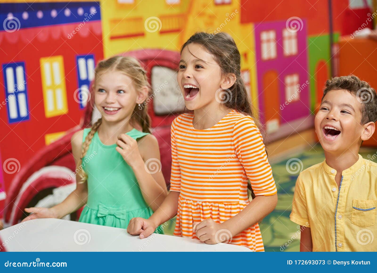 Three Excited Kids in Playroom. Stock Image - Image of club