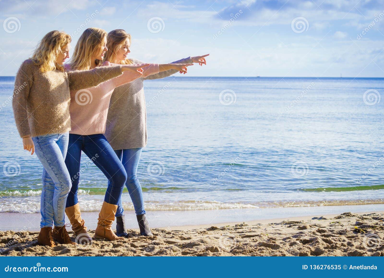 Three Fashionable Models Pointing Outdoor Stock Image - Image of ...