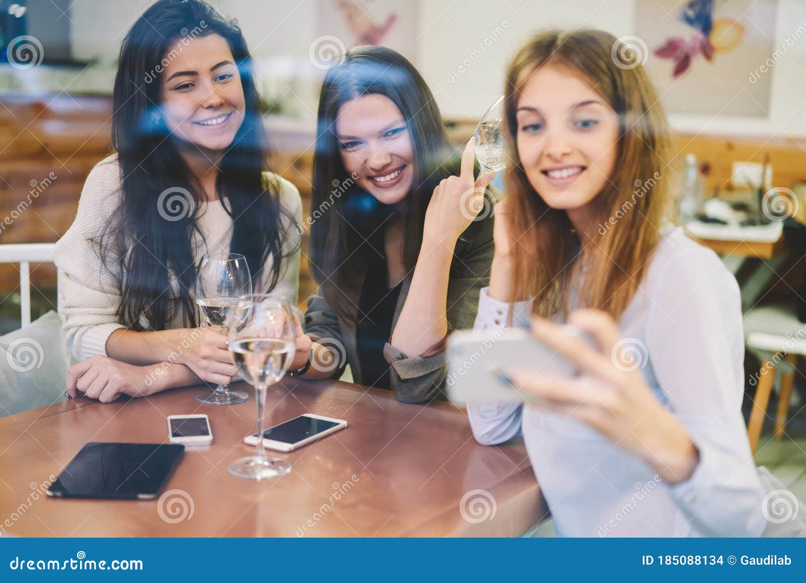 Three Female Friends Enjoying Meeting in Cozy Cafe Stock Photo - Image ...