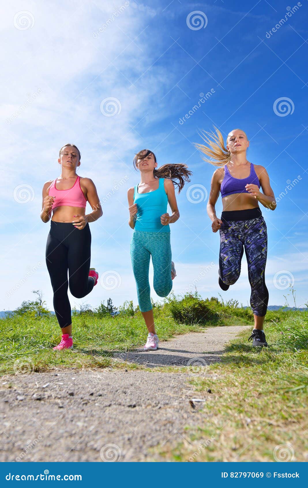 Three Female Joggers Running Together Outdoors Stock Image Image of