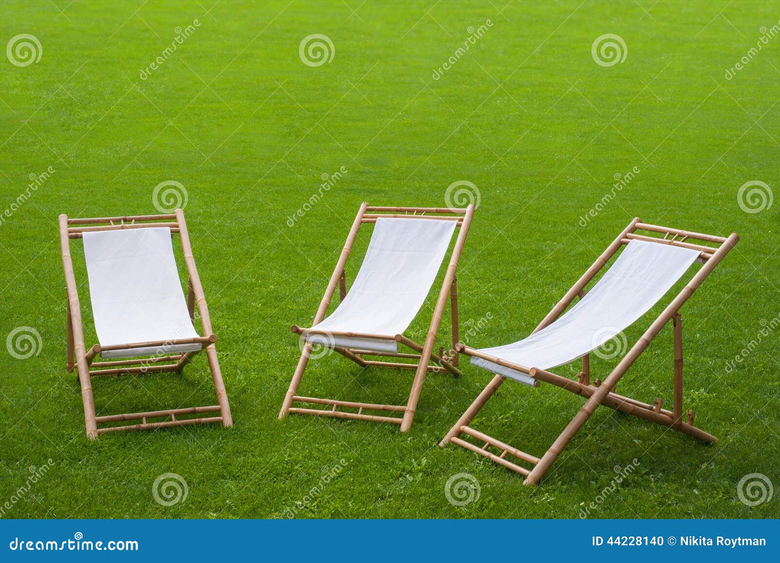 Three Folding Chairs in a Green Park Stock Photo Image of peaceful, lawn 44228140