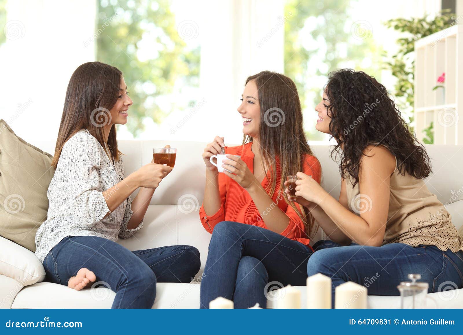 three friends talking at home
