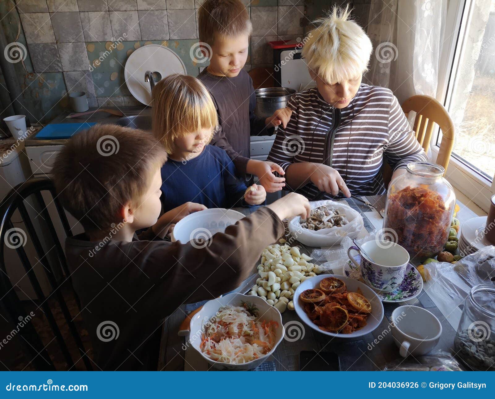 Three Funny Children in the Kitchen Help Their Mother Peel Garlic. Boys Brothers are Happy To Do Useful Things Together Stock Photo - Image of eating, baking: 204036926 Three Funny Children in the Kitchen Help Their Mother Peel Garlic. Boys Brothers are Happy To Do Useful Things Together Stock Photo - Image of eating, baking: 204036926