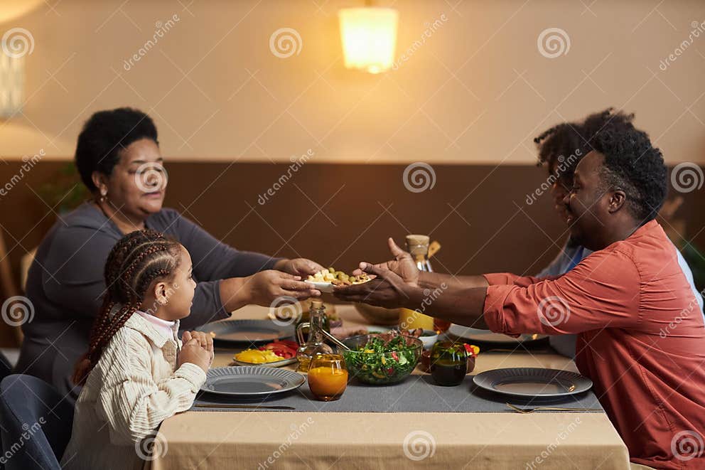 Three Generation Black Family Enjoying Dinner Stock Image - Image of