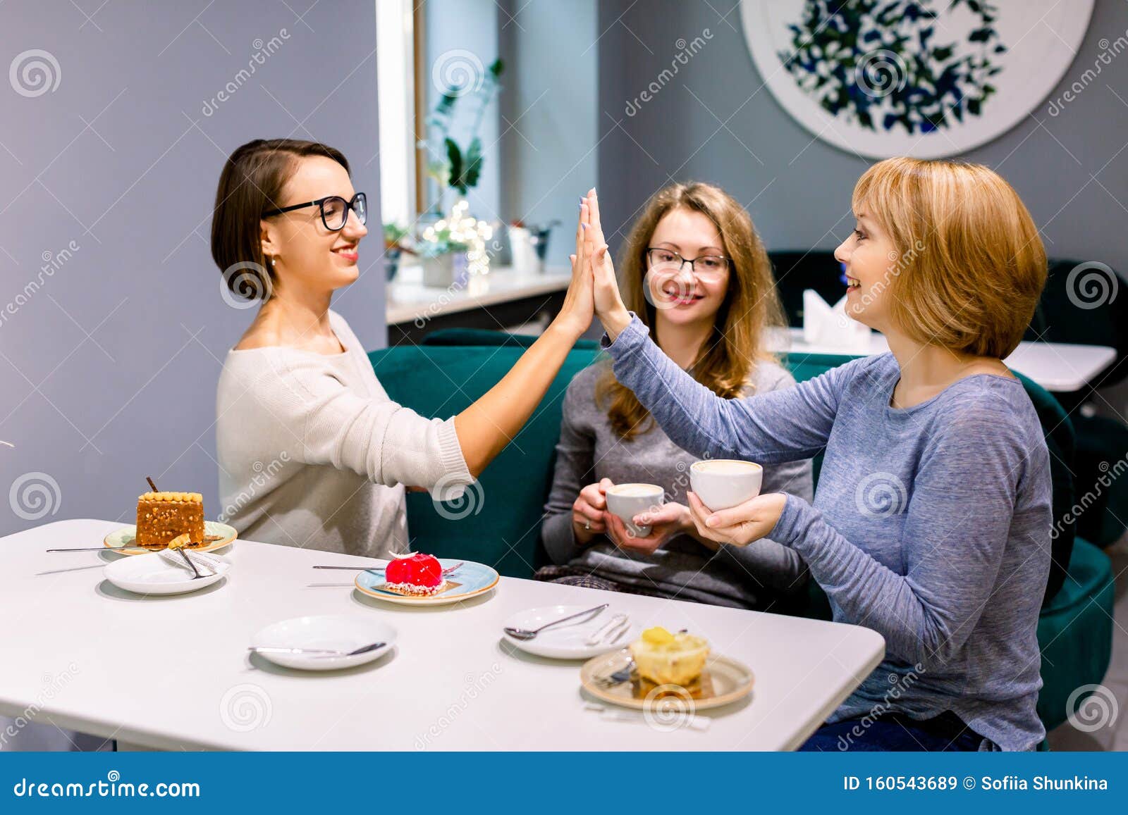 Two Women Giving Five Each Other, Third Woman Holds Stock Image - Image of ...