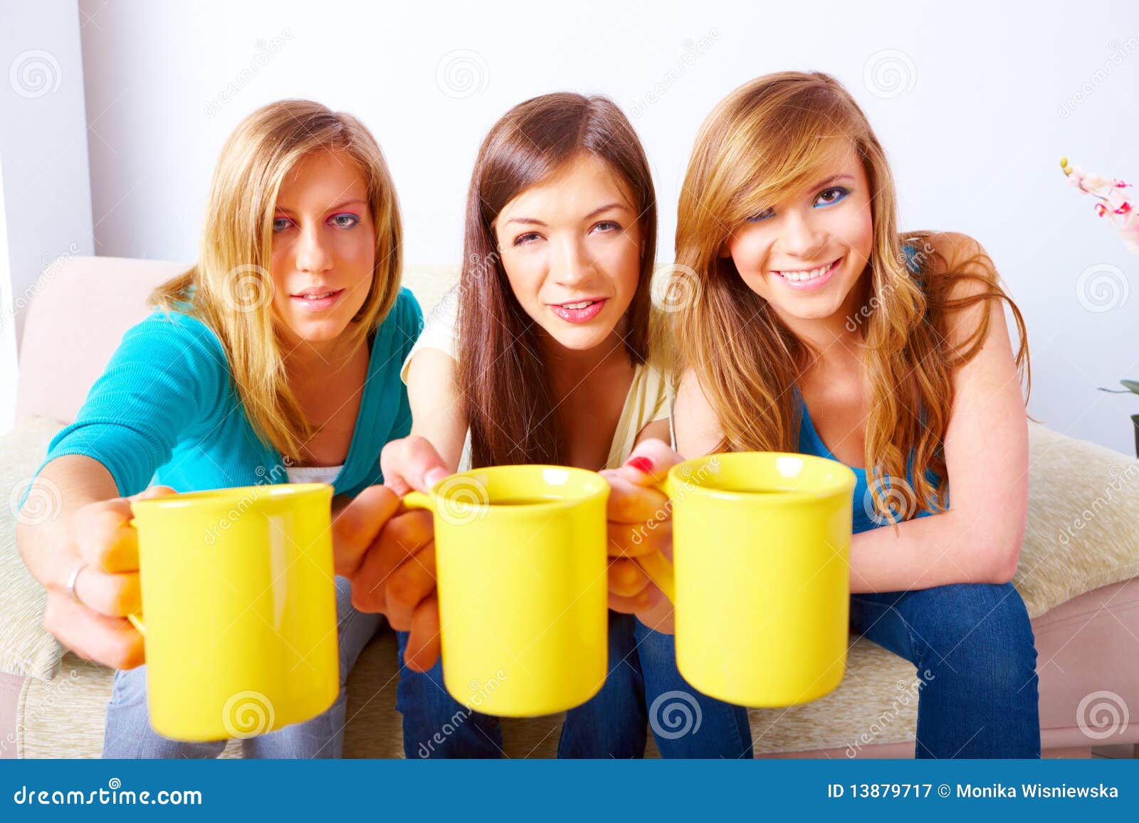 Three girls with cups stock image. Image of indoors, everyday