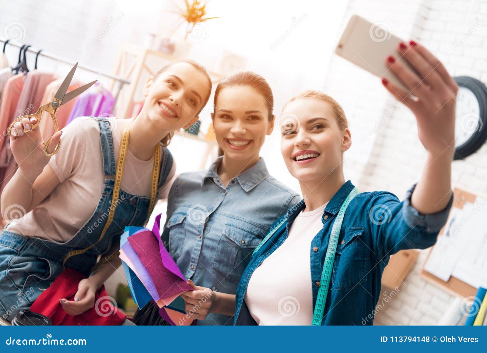 Three Girls at Garment Factory. they are Taking Selfie Desining New ...