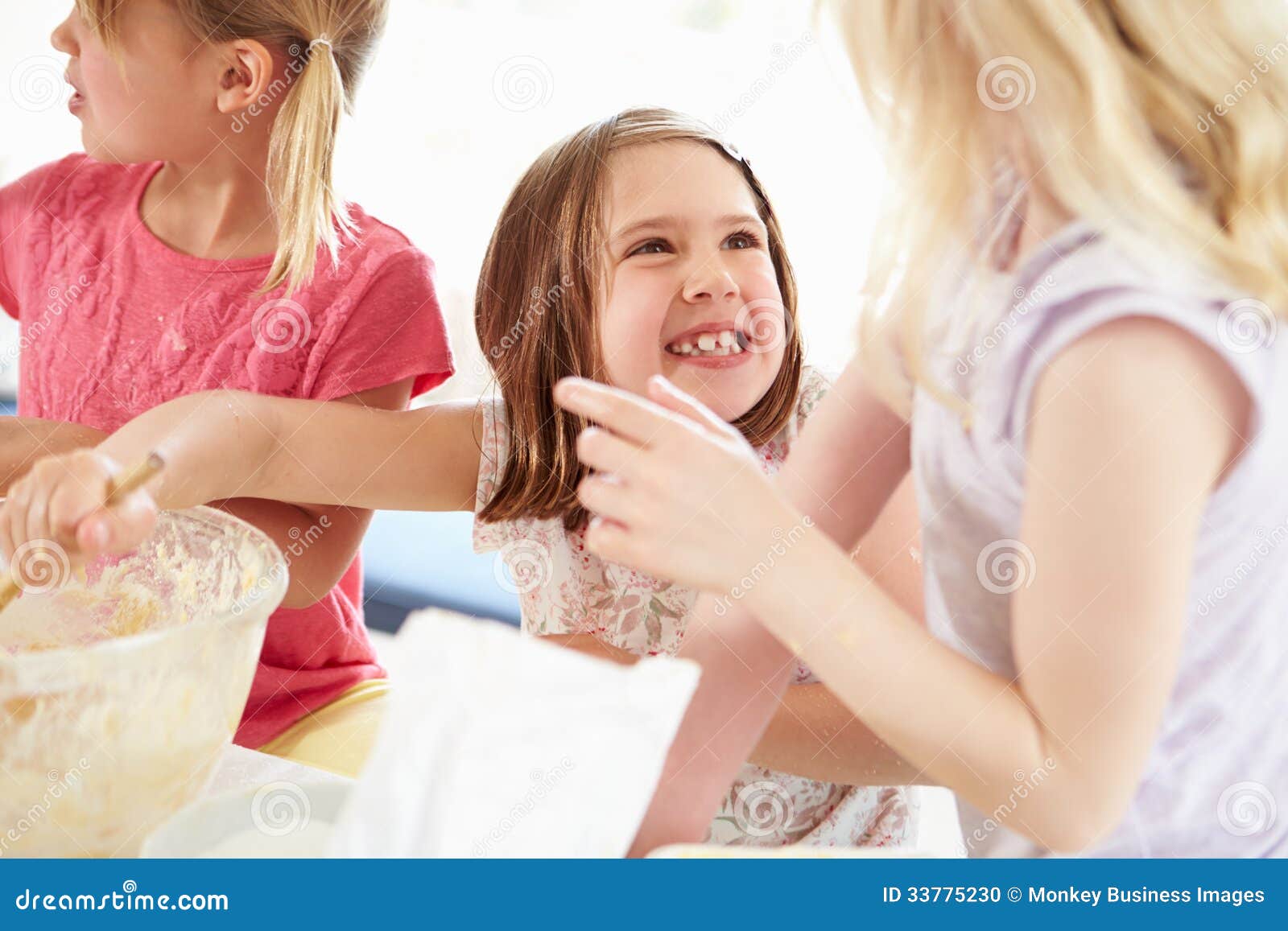 Three Girls Making Cupcakes in Kitchen Stock Ph