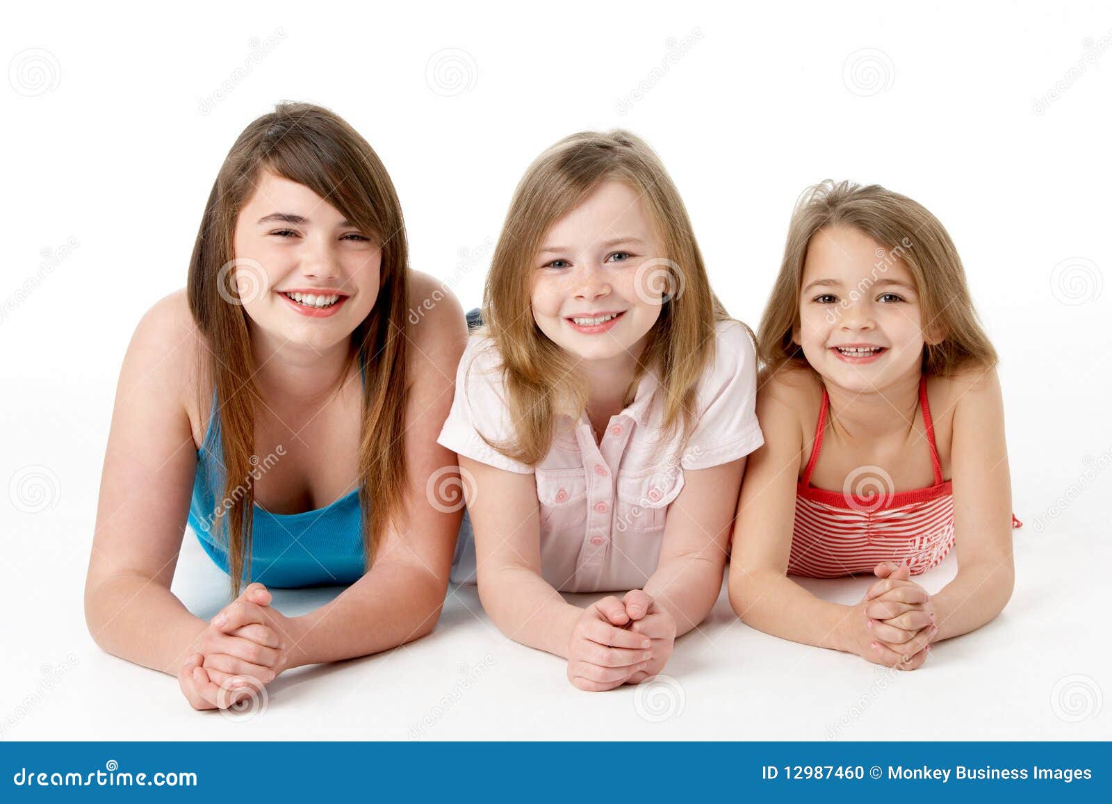 three girls piled up in pyramid in studio