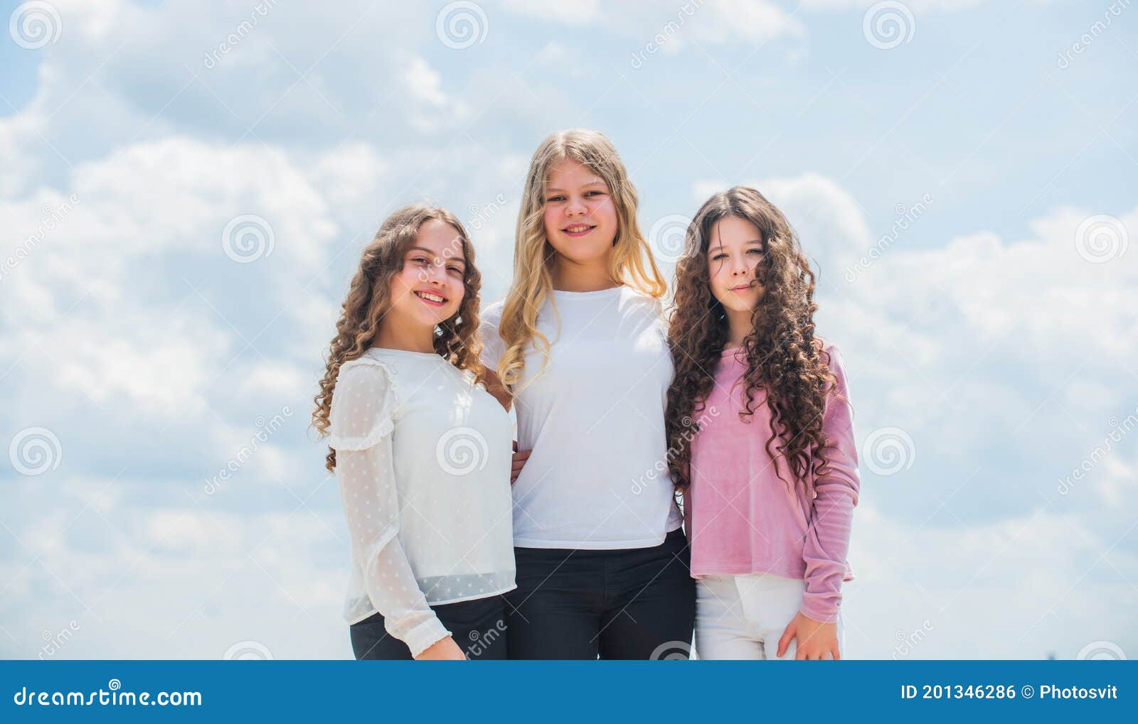 Three Girls on Sky Background. Concept of Female Friendship ...