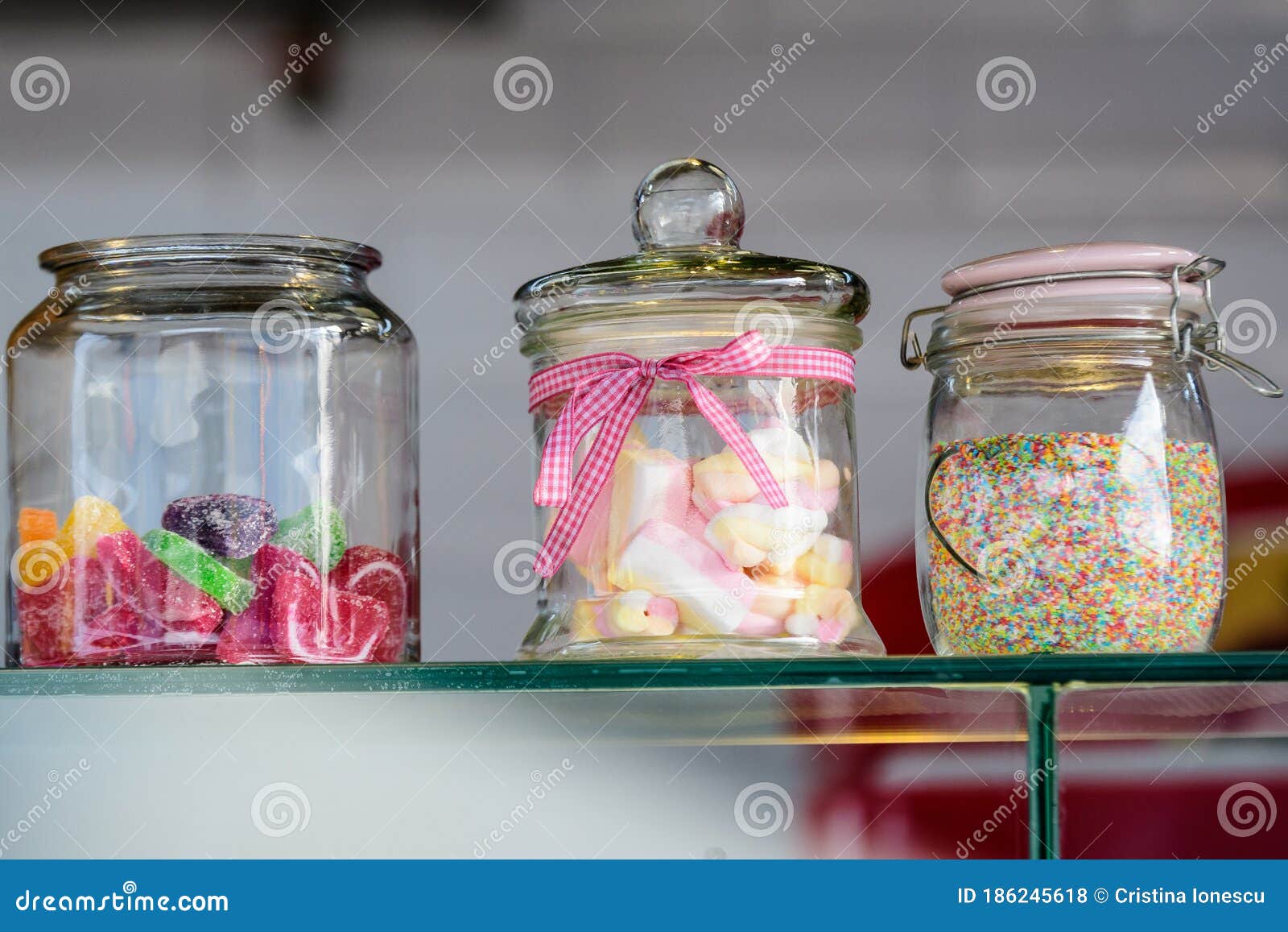 https://thumbs.dreamstime.com/z/three-glass-jars-colorful-sugar-sweets-candies-marshmallows-sprinkles-used-to-decorate-ice-cream-desserts-display-186245618.jpg
