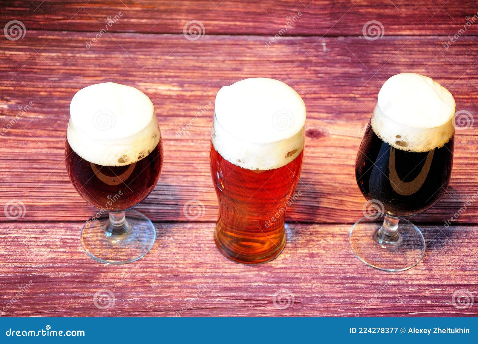 Three Glasses with Different Types of Dark Beer are on a Wooden Table Stock Image Image of