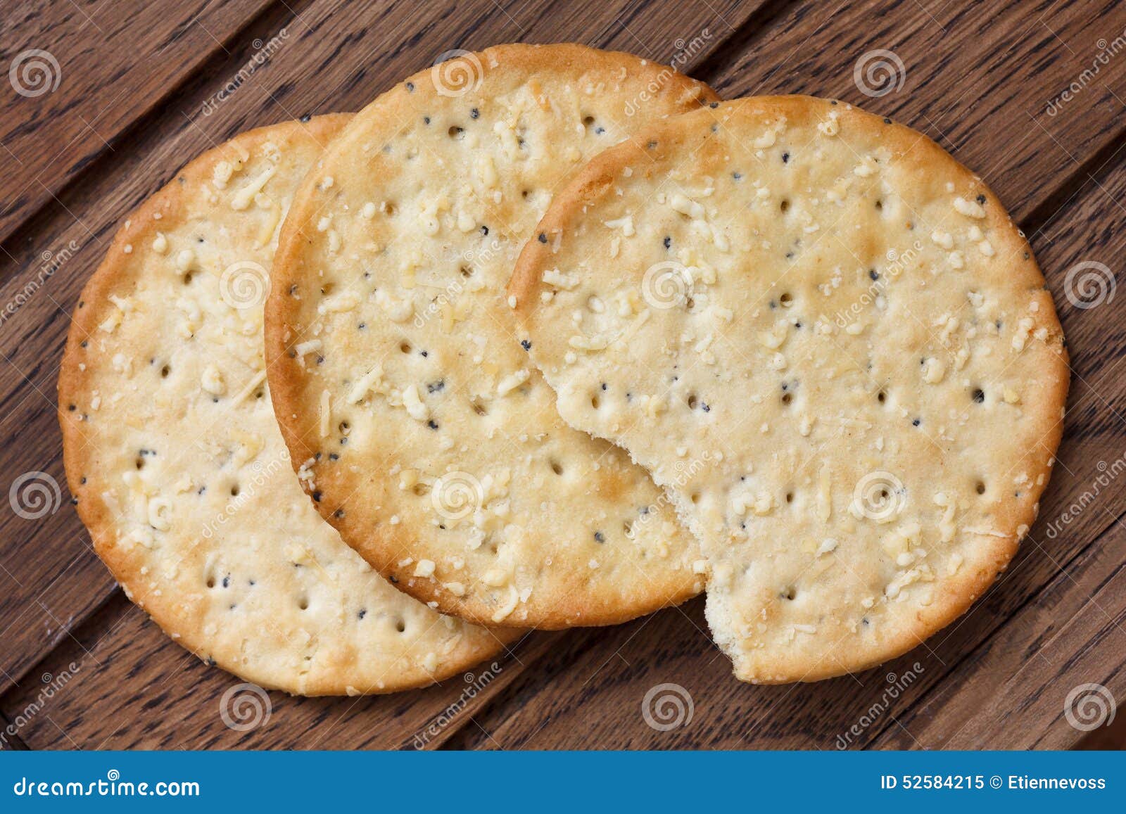 Three Golden Cheese Crackers on Dark Wood Stock Image Image of eaten