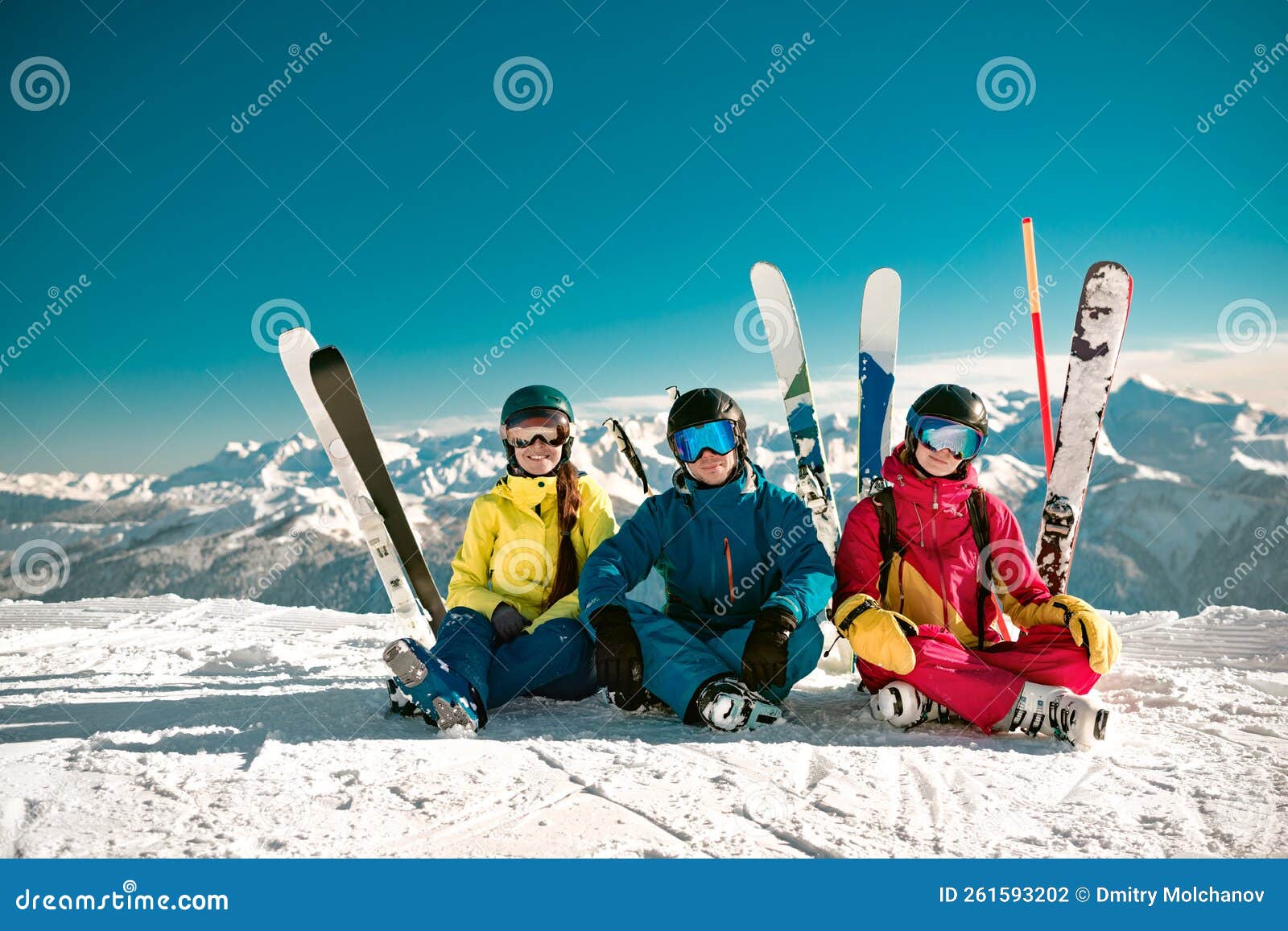 Three Skiers Sits at Mountain Top and Smiles Stock Photo Image of Three Skiers Sits at Mountain Top and Smiles Stock Photo Image of