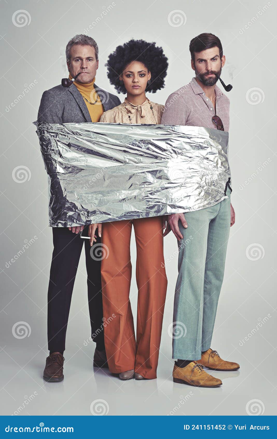 All Wrapped and Ready To Bake. Three Hippies Wrapped in Tin Foil. Stock