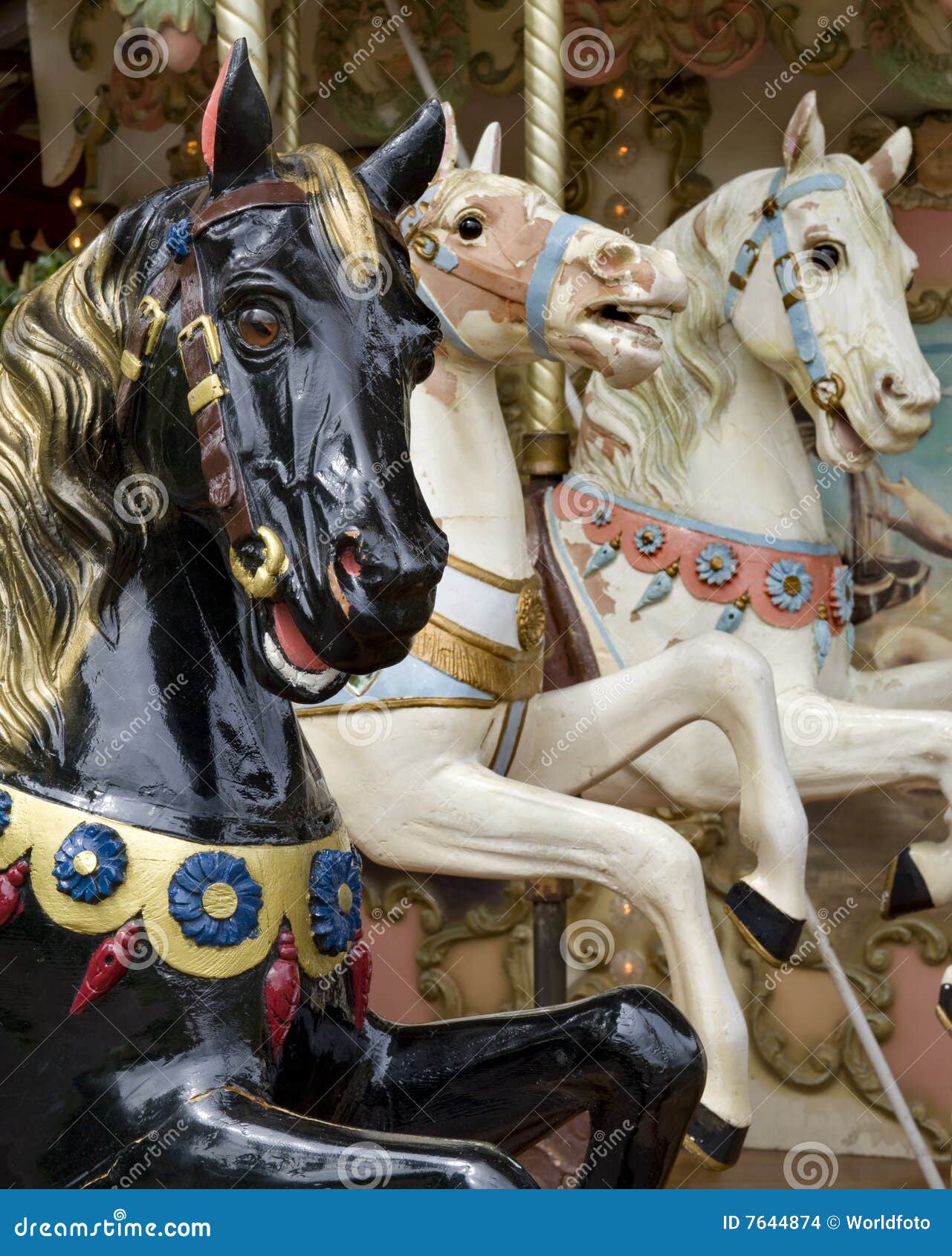 three horses on fairground carousel
