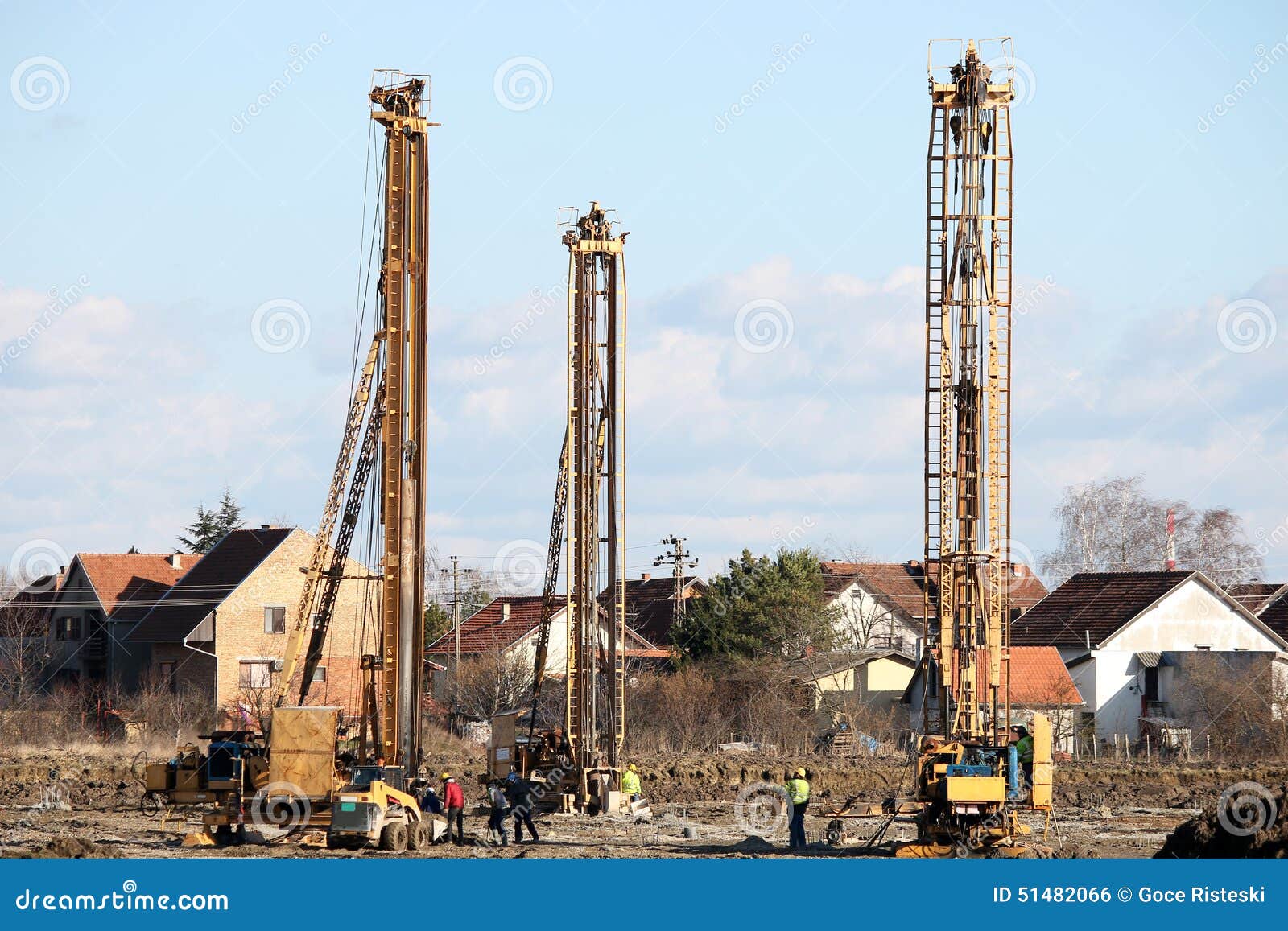 Three Hydraulic Drilling Machines and Workers Stock Photo Image of