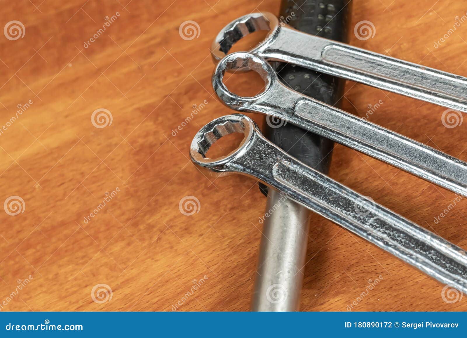 Three Iron Wrenches Lies on the Handle of a Hammer Set Hand Tool Stock