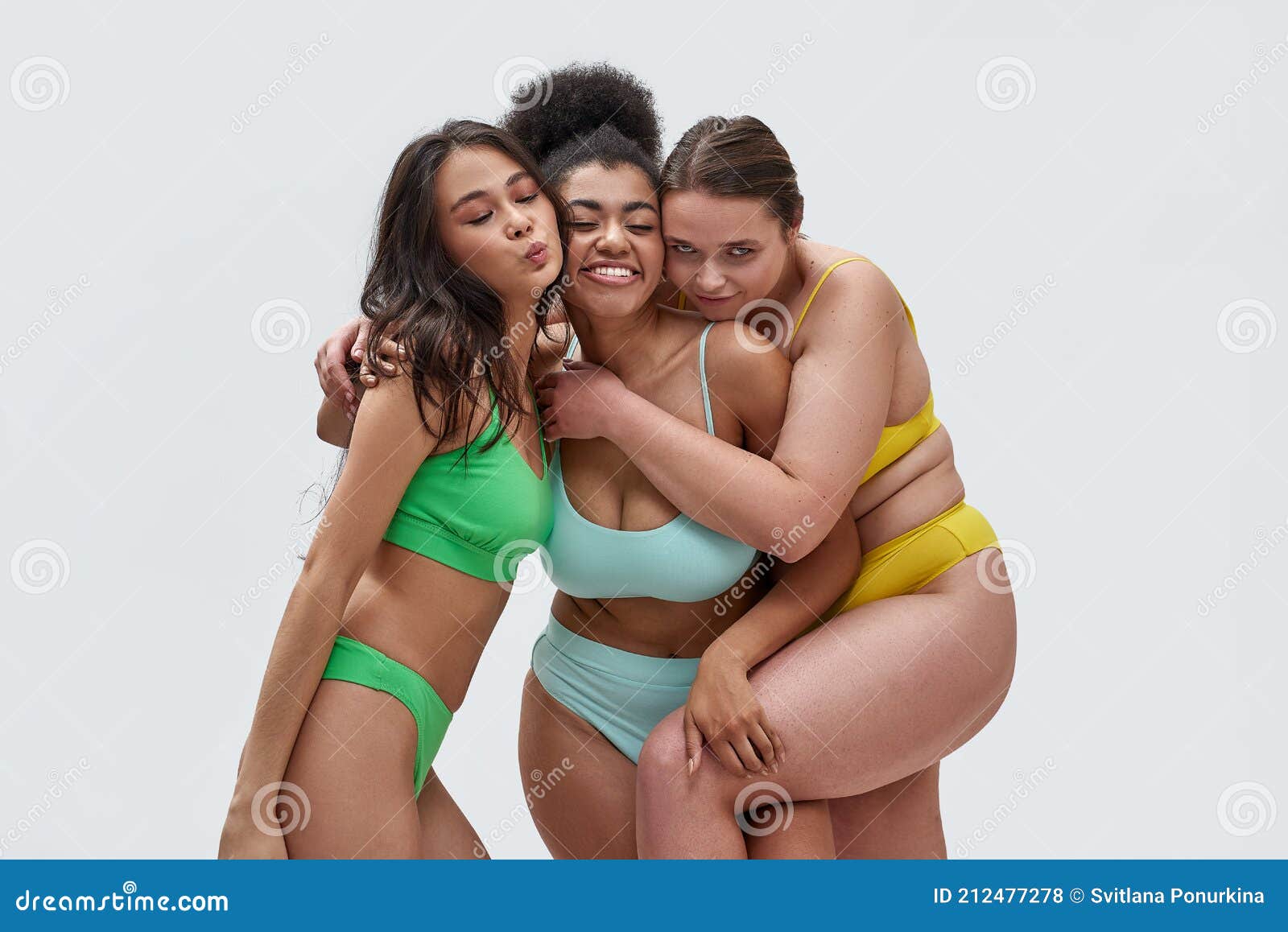 Three Joyful Young Women with Different Body Types in Colorful