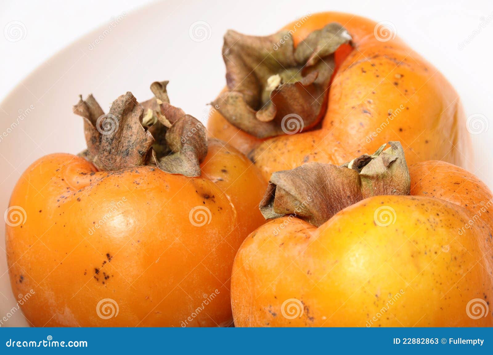 three kaki exotic fruit stock photos - image: 22882863