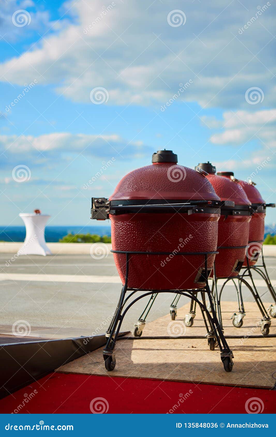 Three Kettle Barbecue Grill with Cover on Outdoor. Ready for Cook