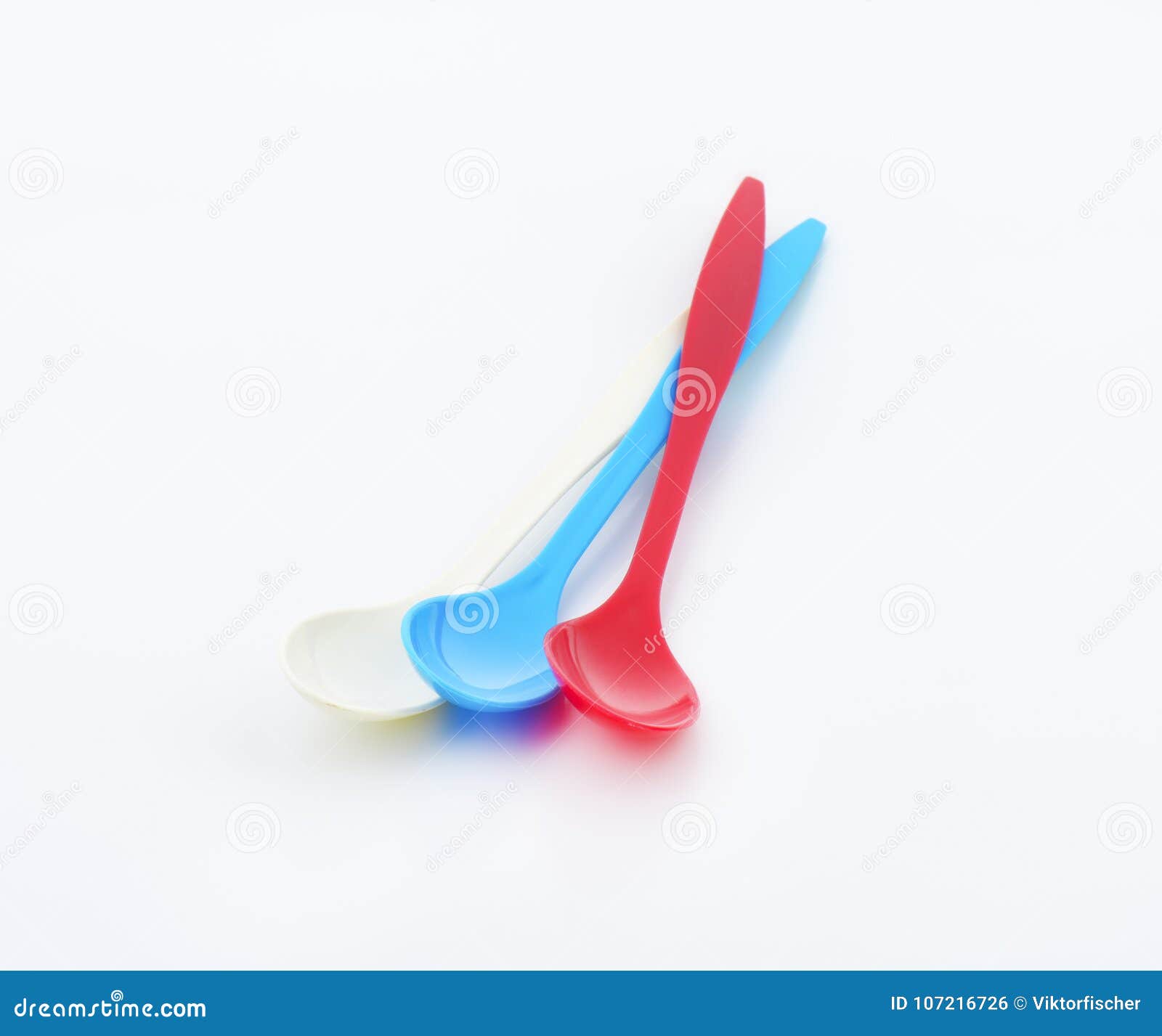 Three long plastic spoons stock photo. Image of long 107216726