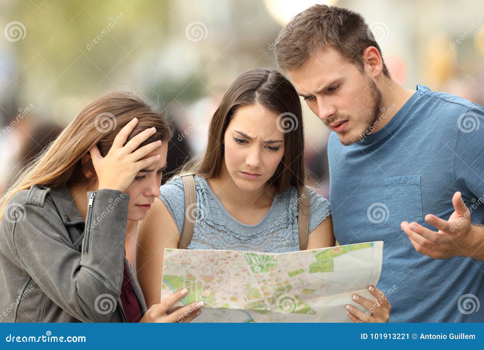 three lost tourists trying to find a location in a map