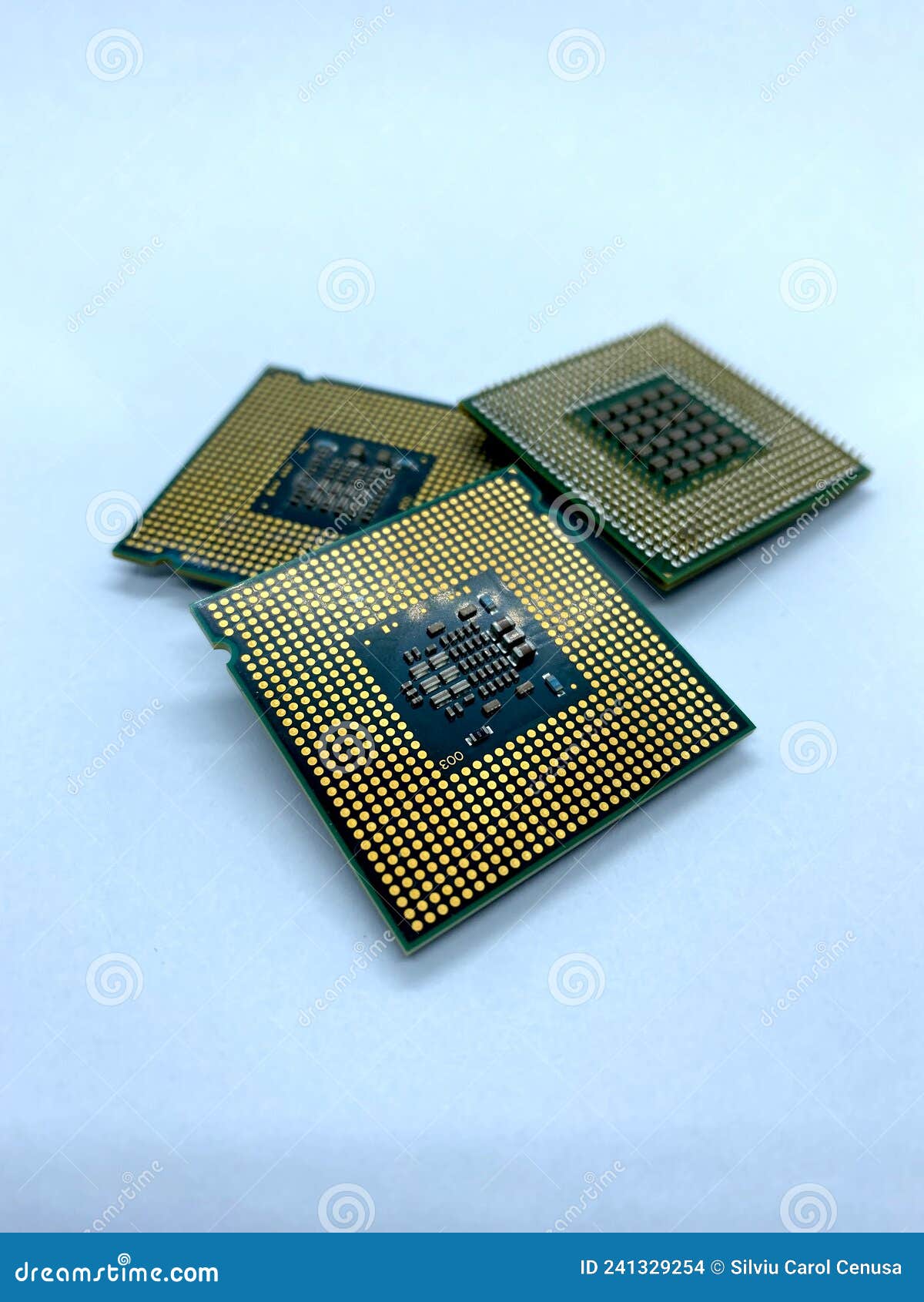 three micro processors stack closeup view  on white