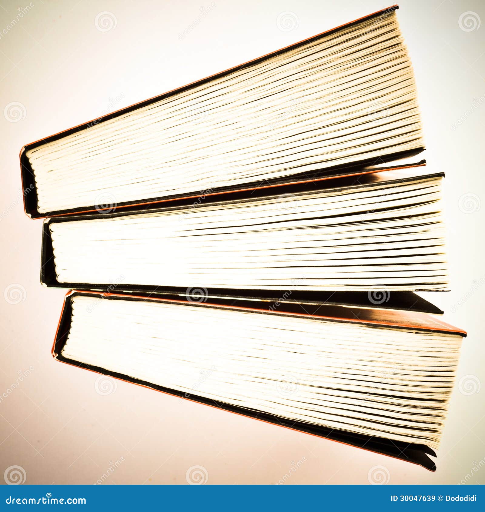 Books. Three miniature paperbacks from above