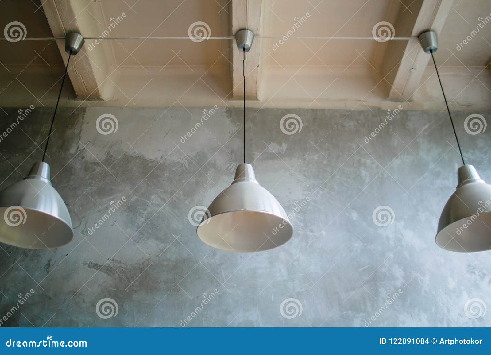 Three Modern Lamps On Concrete Ceiling White And Silver Lamps