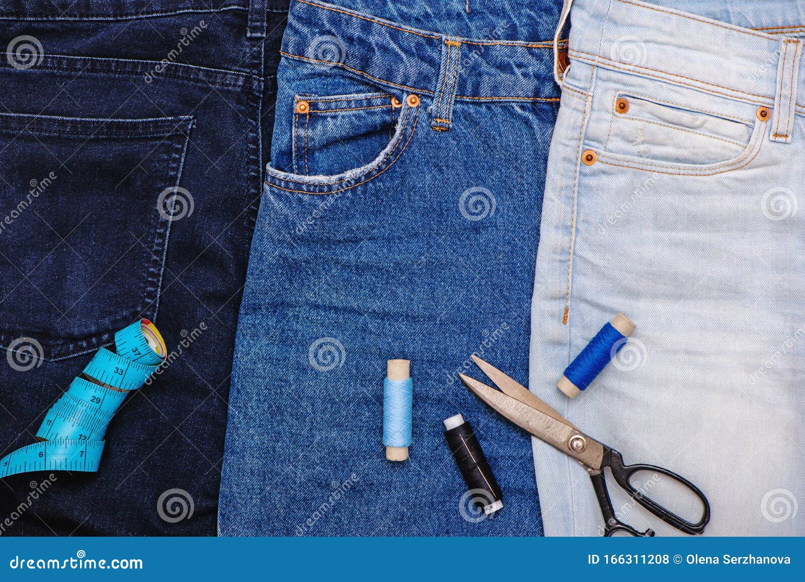 Three Pair of Jeans with Scissors, Threads and Tailor Meter. Stock