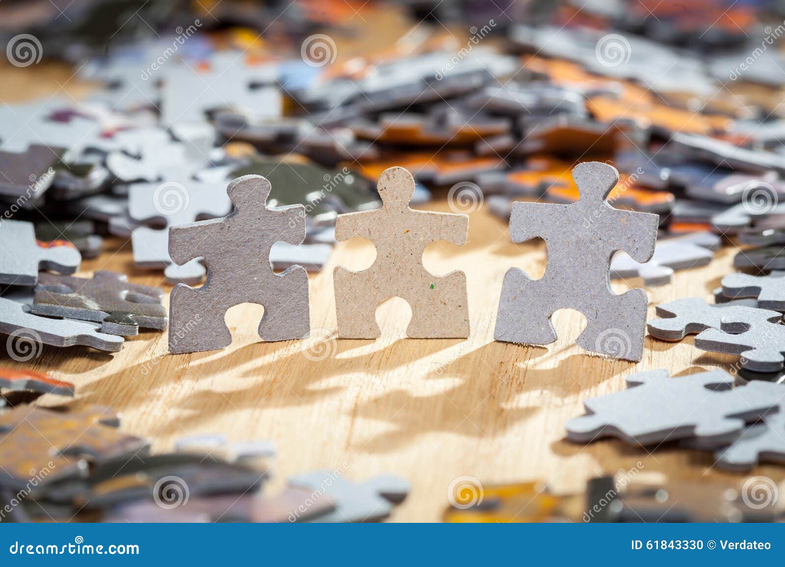 Three paper jigsaw puzzles stock photo. Image of solution 61843330