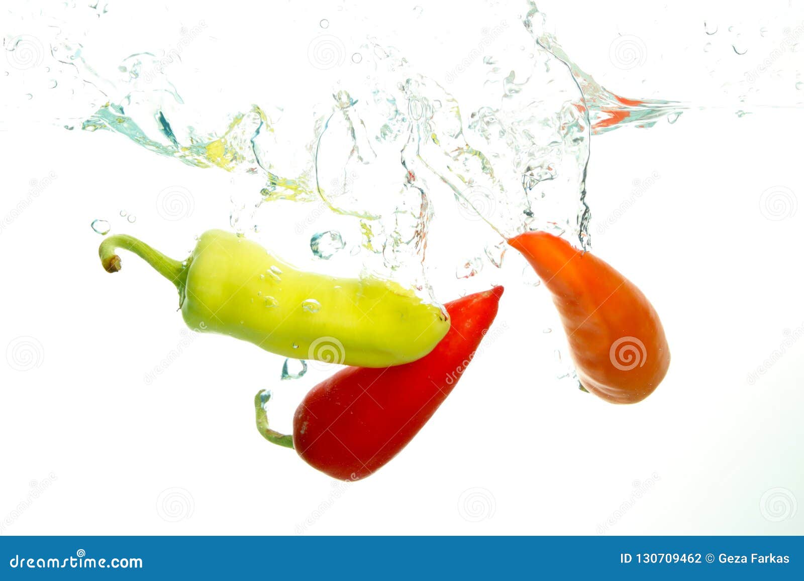 Three Paprika in Water Splash on White Stock Photo Image of washing