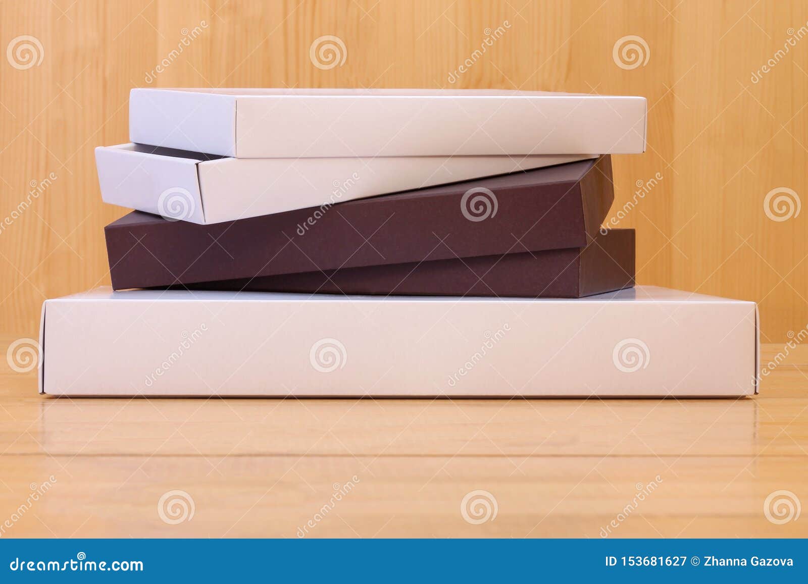 delivery, moving, package and gifts concept - pile of cardboard boxes on wooden background. holiday gifts, courier delivery.