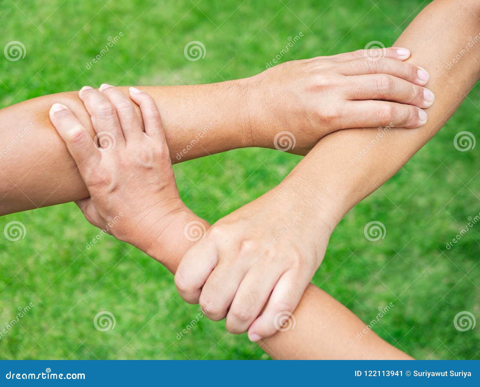 three-people-join-hands-together-grass-background-friendship-three-people-join-hands-together-grass-background-friendship-122113941.jpg