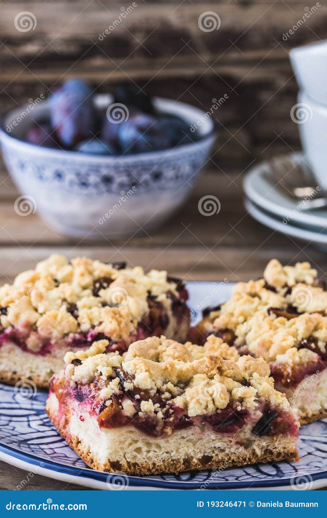 three pieces of plum cake with crumble