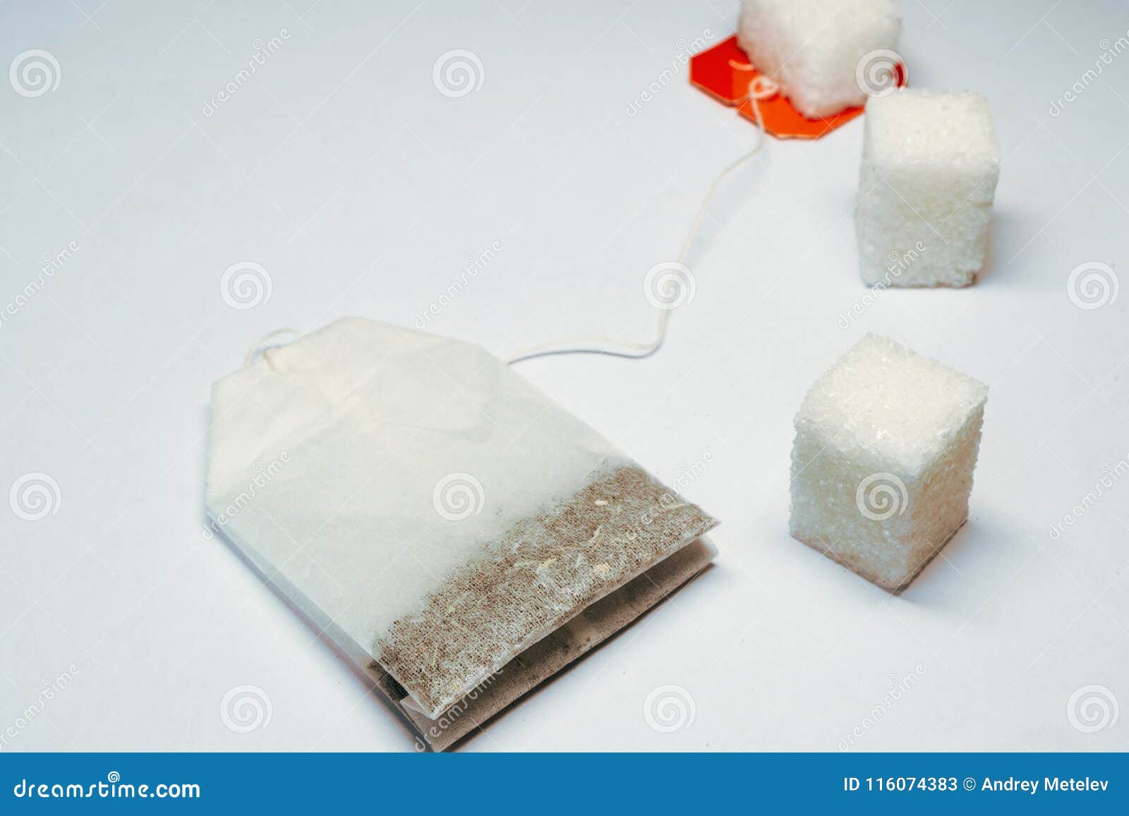 Three Pieces of White Sugar and Tea Bag on White Background, Tea and