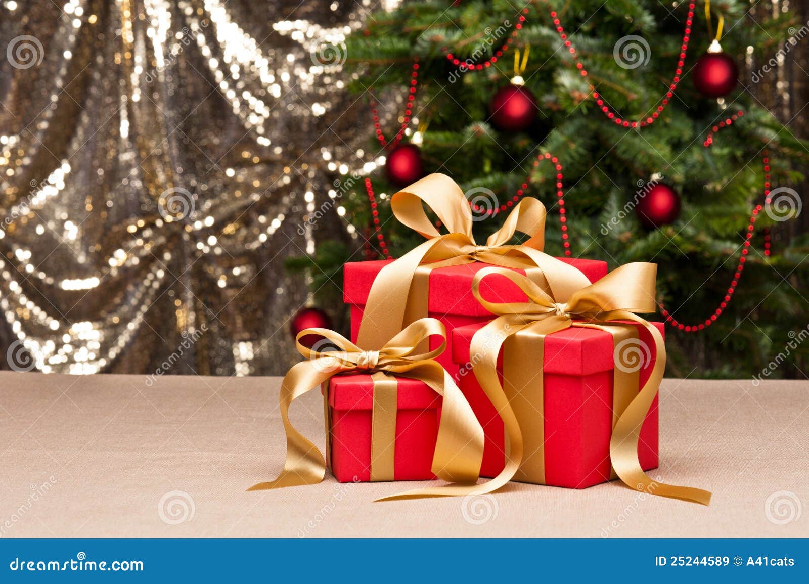 Three Presents with Gold Ribbon Stock Image Image of present, pine