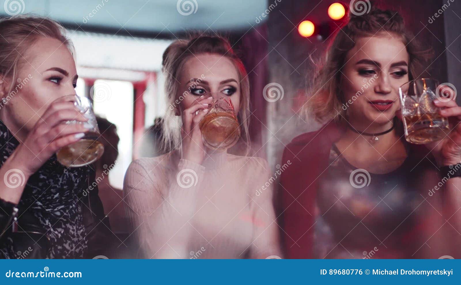 Three Pretty Girls Having A Conversation Laughing And Drinking Alcohol Awaited Meeting Stock