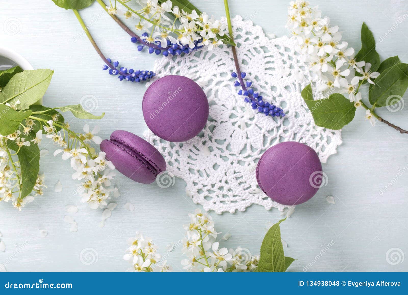 Three Purple Macaroons Cookies and Flowers Stock Photo - Image of flat ...