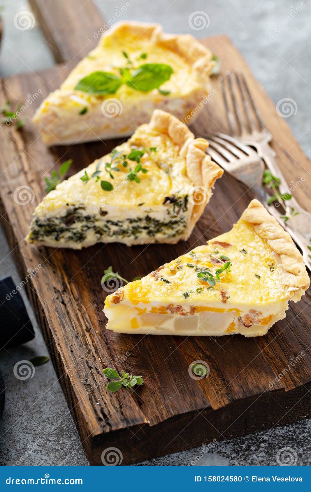 Three Quiche Pieces on a Serving Board Stock Photo - Image of board ...