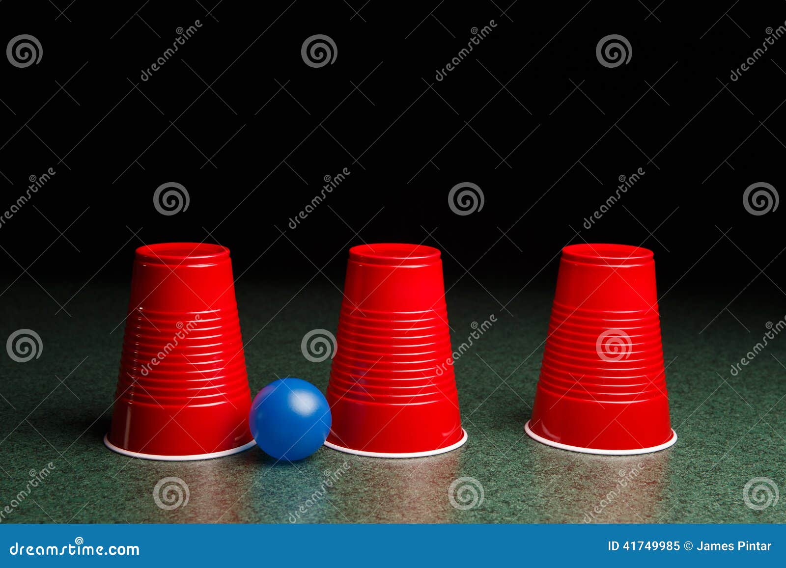 Three Red Cups and a Blue Ball Stock Image - Image of gaming, games