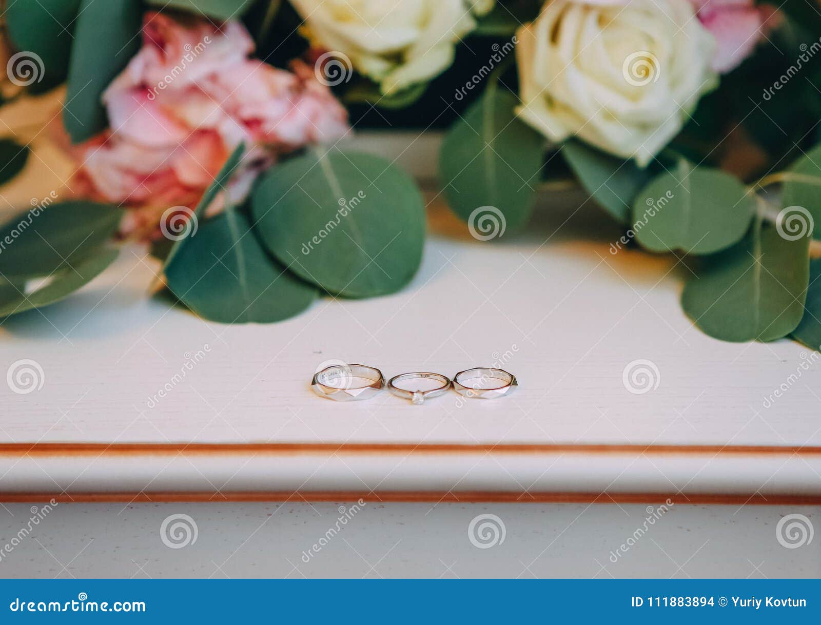 Three Rings on a Table Large Bouquet of Flowers Roses Stock Photo ...