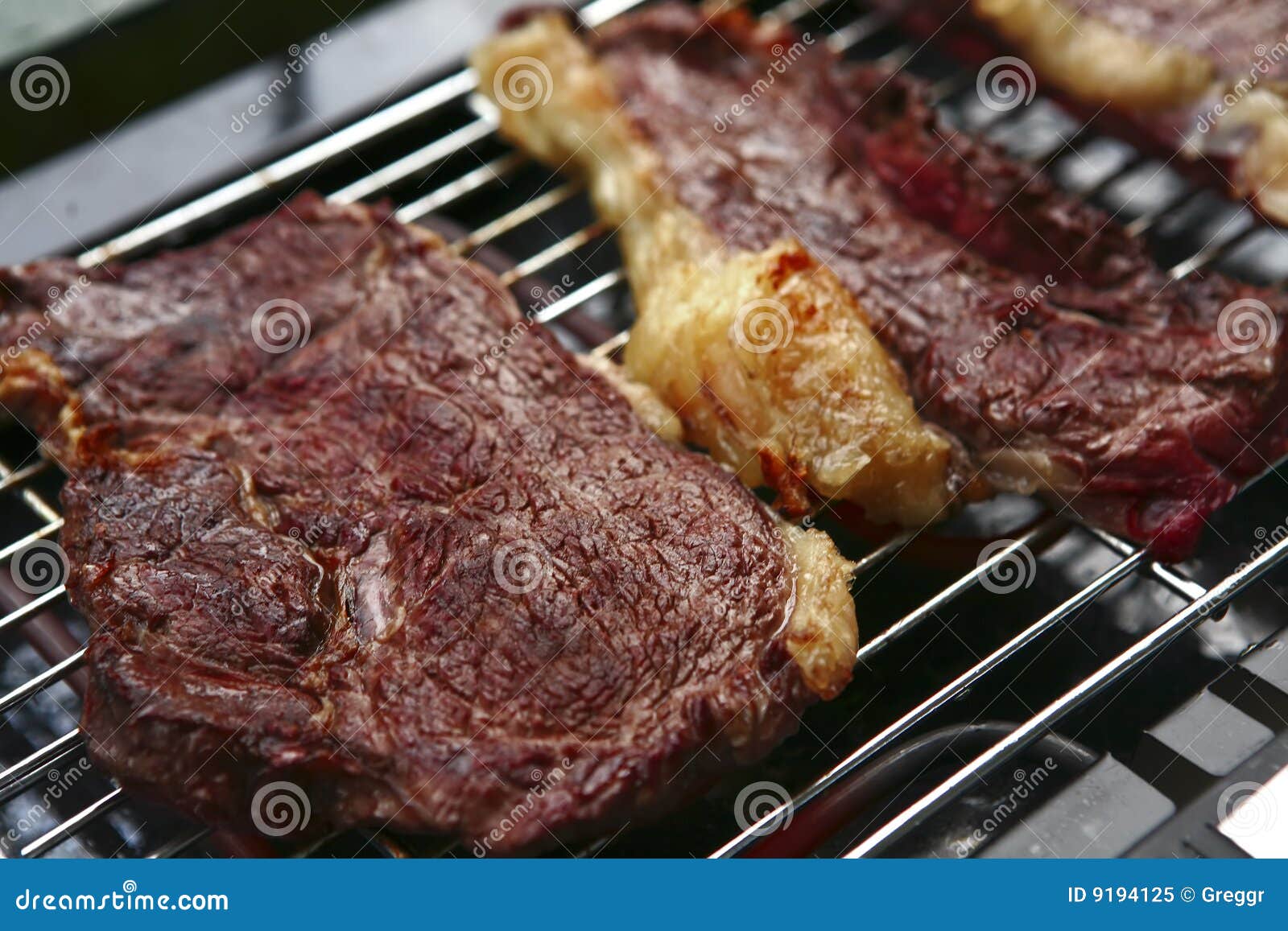 three roast steak on electrical brazier