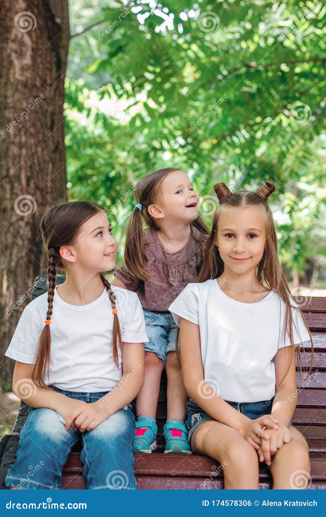 Three Sisters Smiling and Hugging Outdoors in Summer Park. Stock ...
