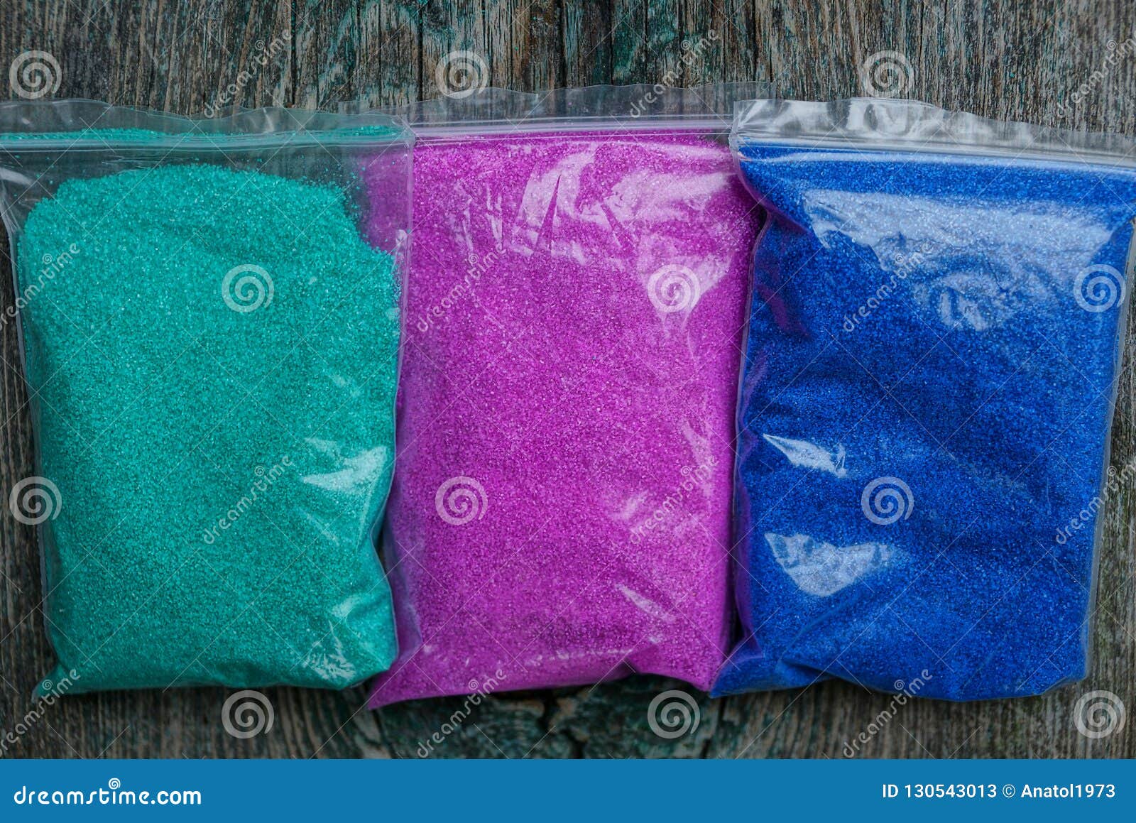 Three Plastic Bags with Colored Sand on the Table Stock Image Image