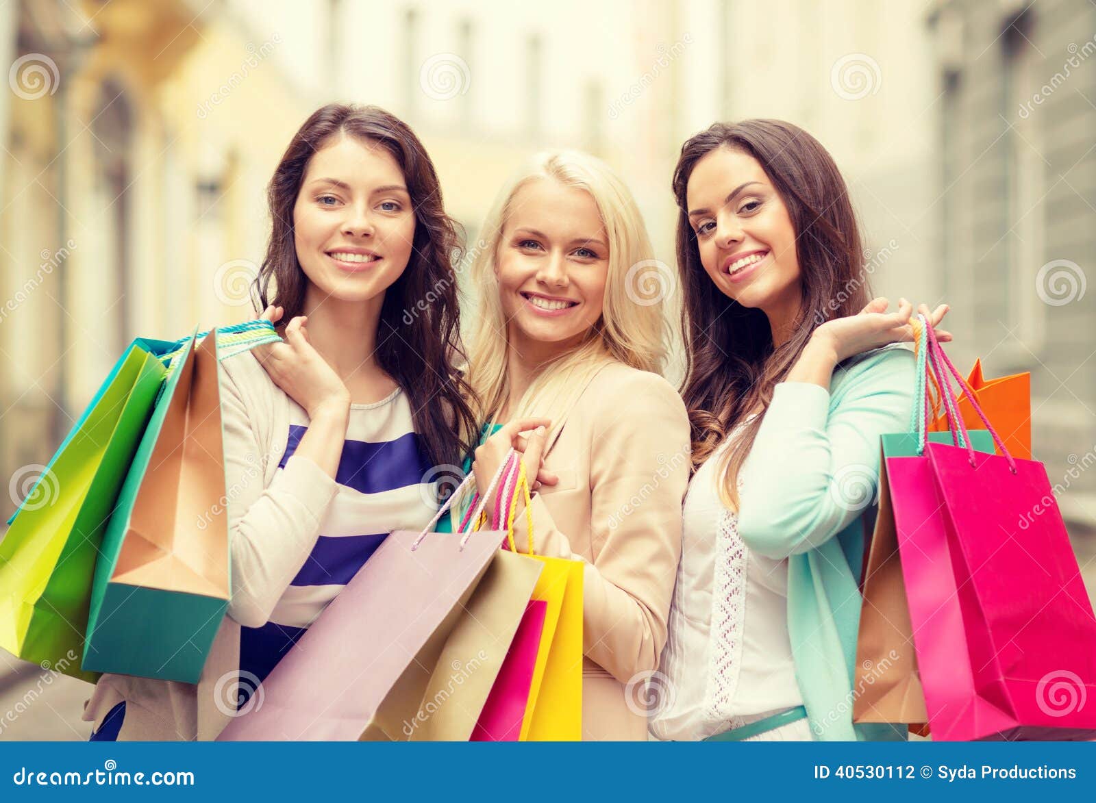 Three Smiling Girls with Shopping Bags in Ctiy Stock Photo - Image of ...